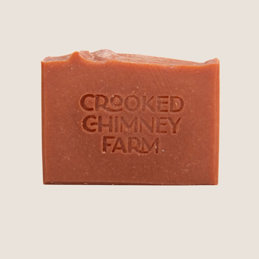 A bar of ember soap on white background