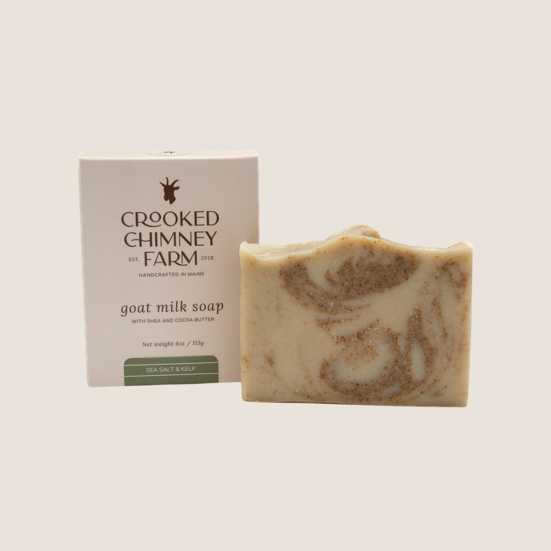 A bar of sea salt and kelp soap sitting next to soap box with label.