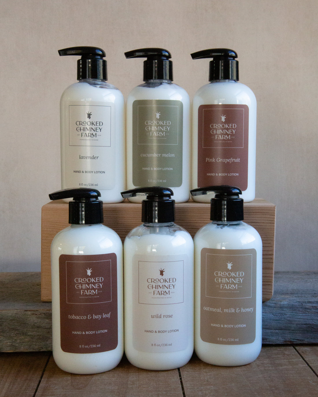 6 8oz bottles of Crooked Chimney Farm Hand and body lotion; lavender, cucumber melon, pink grapefruit, tobacco and bay leaf, wild rose, and oatmeal milk and honey.