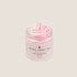 a 4oz jar of wild rose sugar whipped soap from crooked chimney farm. It is pink and white swirled, piped into a clear plastic jar with a tan and brown label.