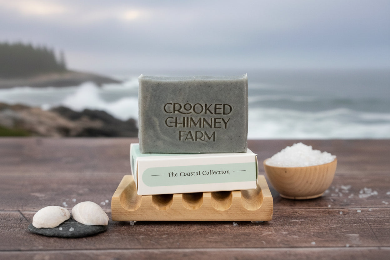 a bar of drift soap in front of the maine coast line