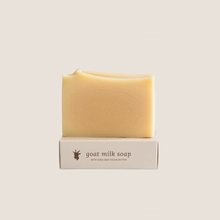Load image into Gallery viewer, a bar of naked goat milk soap sitting on top of it&#39;s box 
