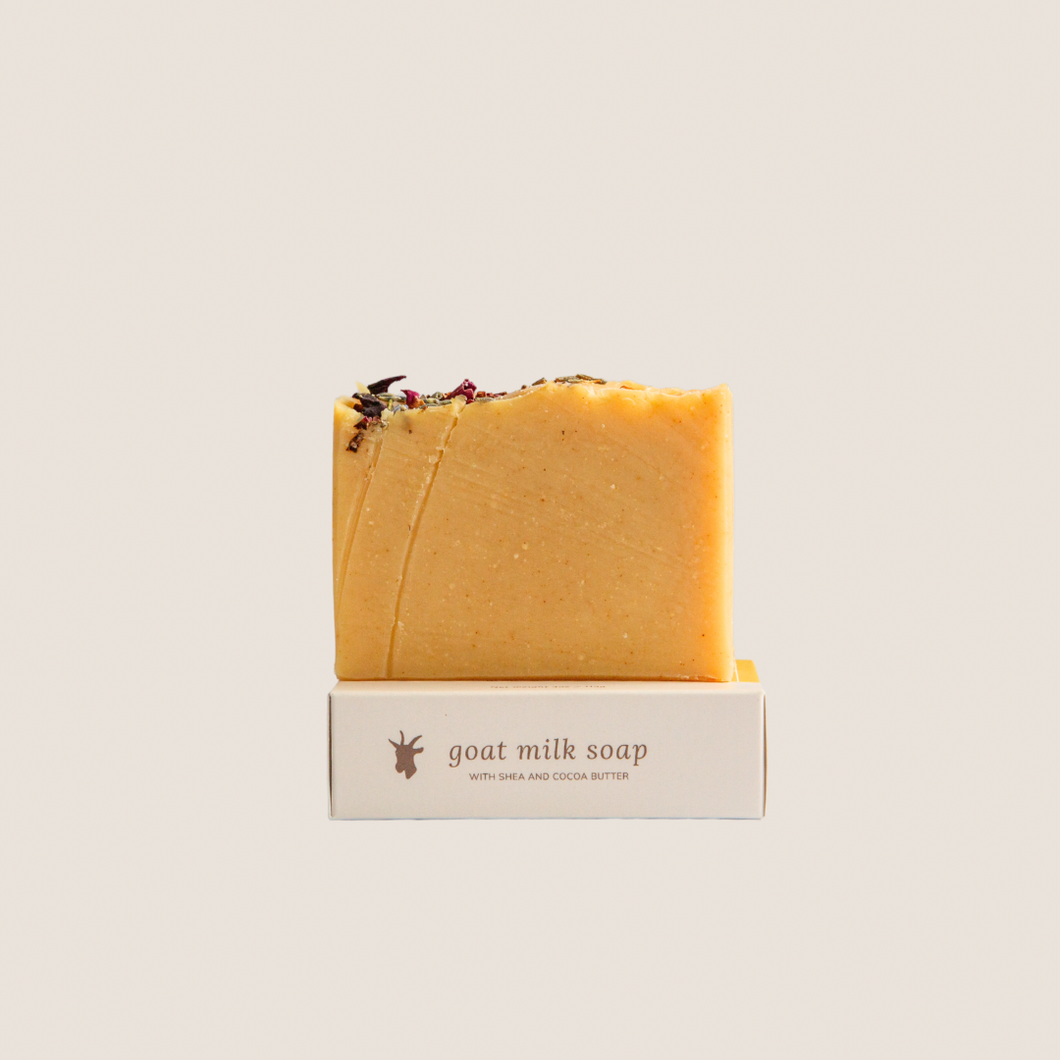 Bergamot and honey goat milk soap on a soap box