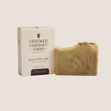 Load image into Gallery viewer, Cardamom &amp; Cedar soap bar next to soap box, beige background
