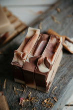 Load image into Gallery viewer, Brown and white swirled coconut goat milk soap bars. 
