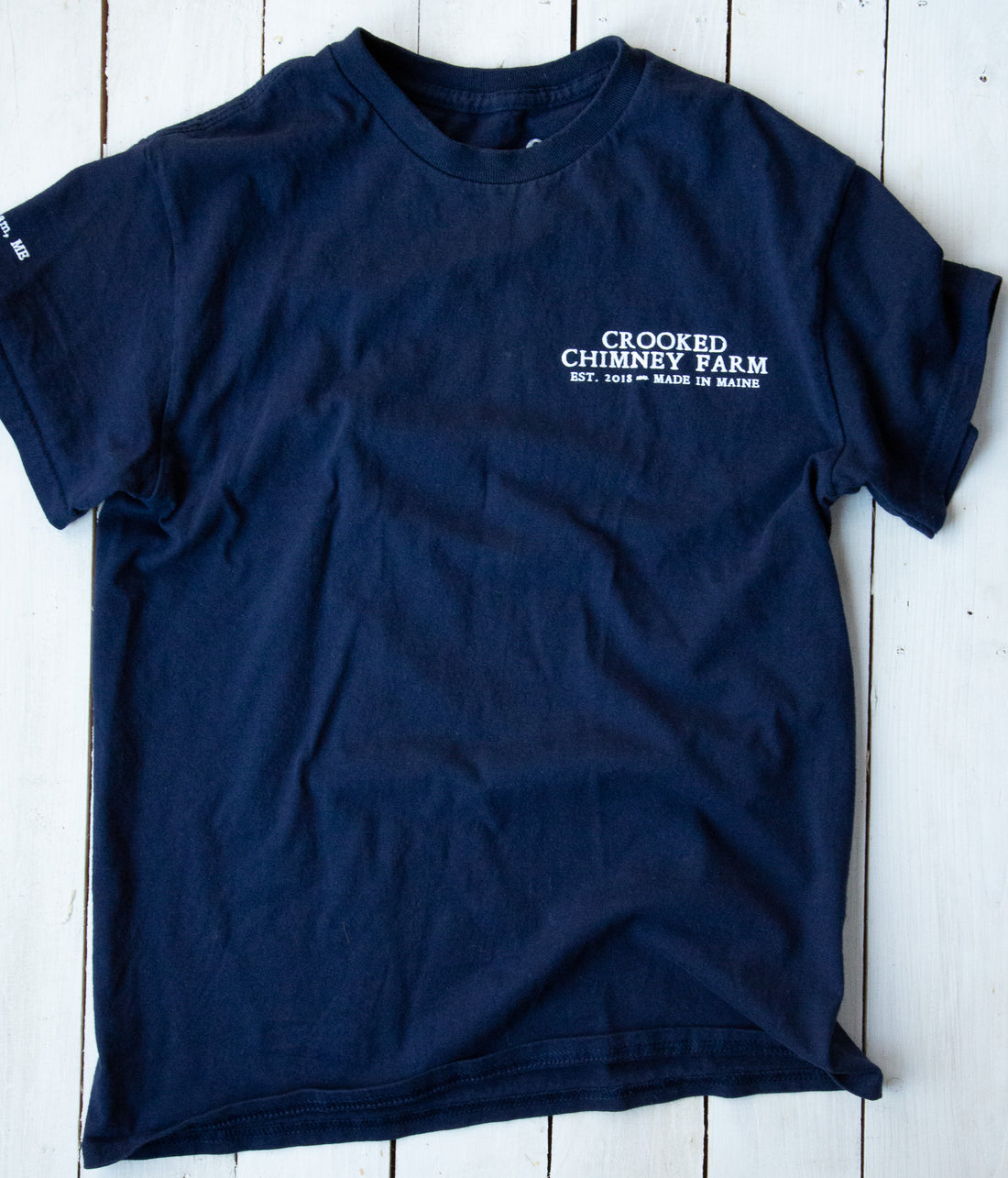 Navy Blue Crooked Chimney Farm Tee Shirt, front. Farm Name on left chest.