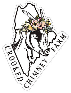 Sticker. Maine state outline with goat wearing flower crown in the middle and Crooked Chimney Farm Text underneath. 