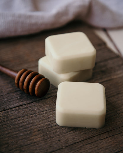 Square honey solid lotion bar with honey drizzle stick
