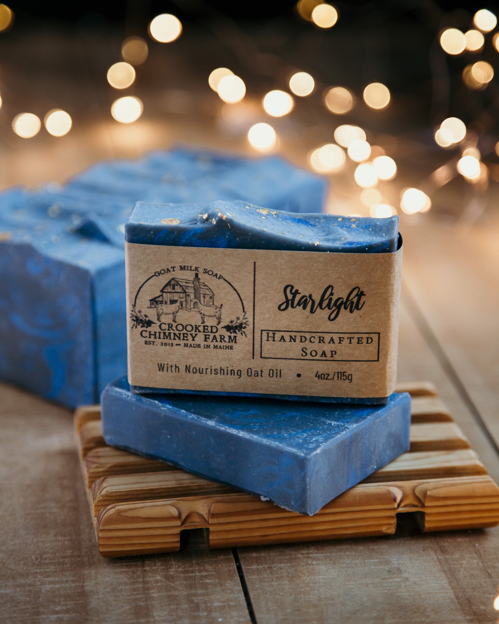 Starlight bar soap on soap deck with more soap and twinkle lights in the background