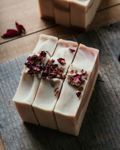 Crooked Chimney Farm Wild Rose Goat Milk Soap, top view with dried rose petals. 